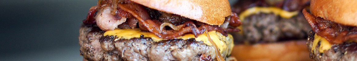 Eating Burger Sandwich at Burgers Shakes and Fries restaurant in Darien, CT.